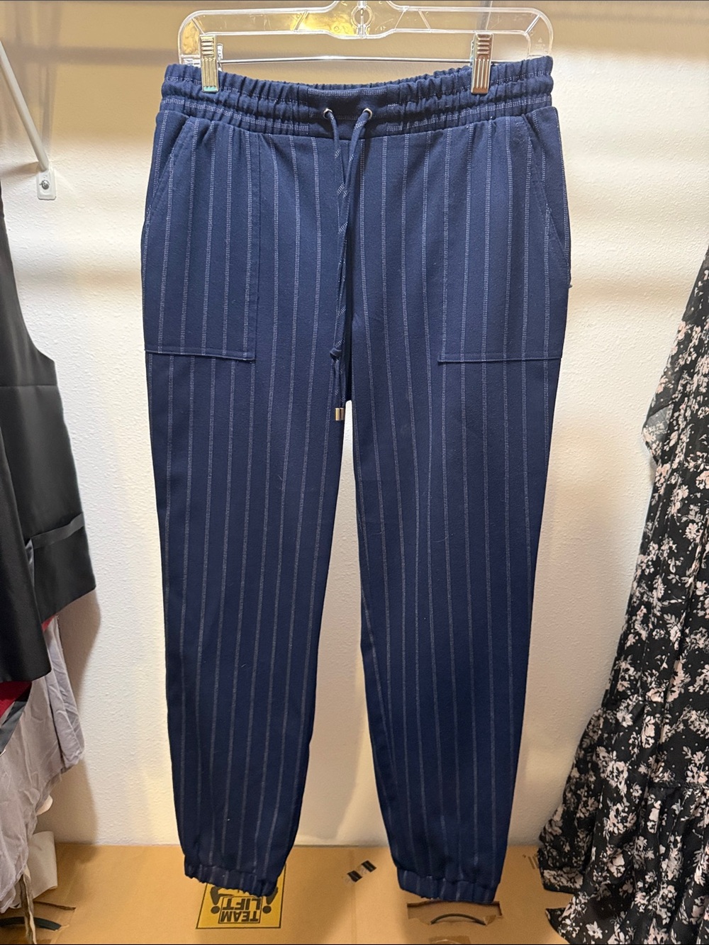 Navy blue dressier pants with white stripes